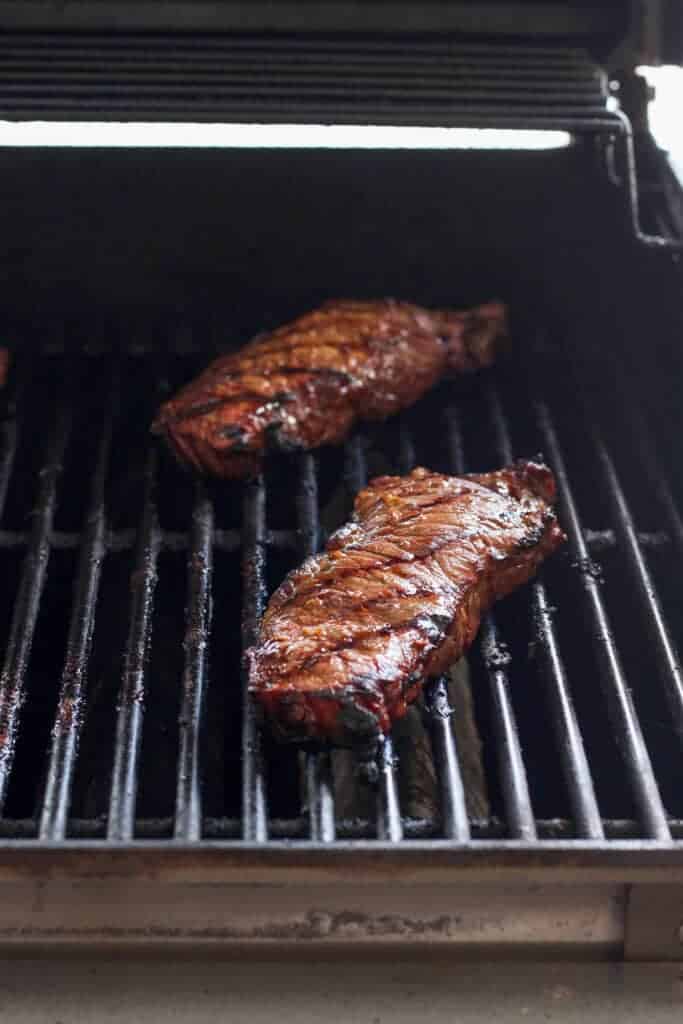 Grilling steak on bbq sale