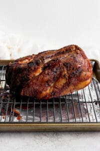 a bbq pork roast on a baking sheet.