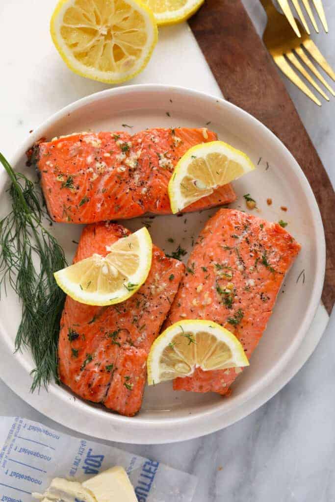 seared salmon fillets on plate.