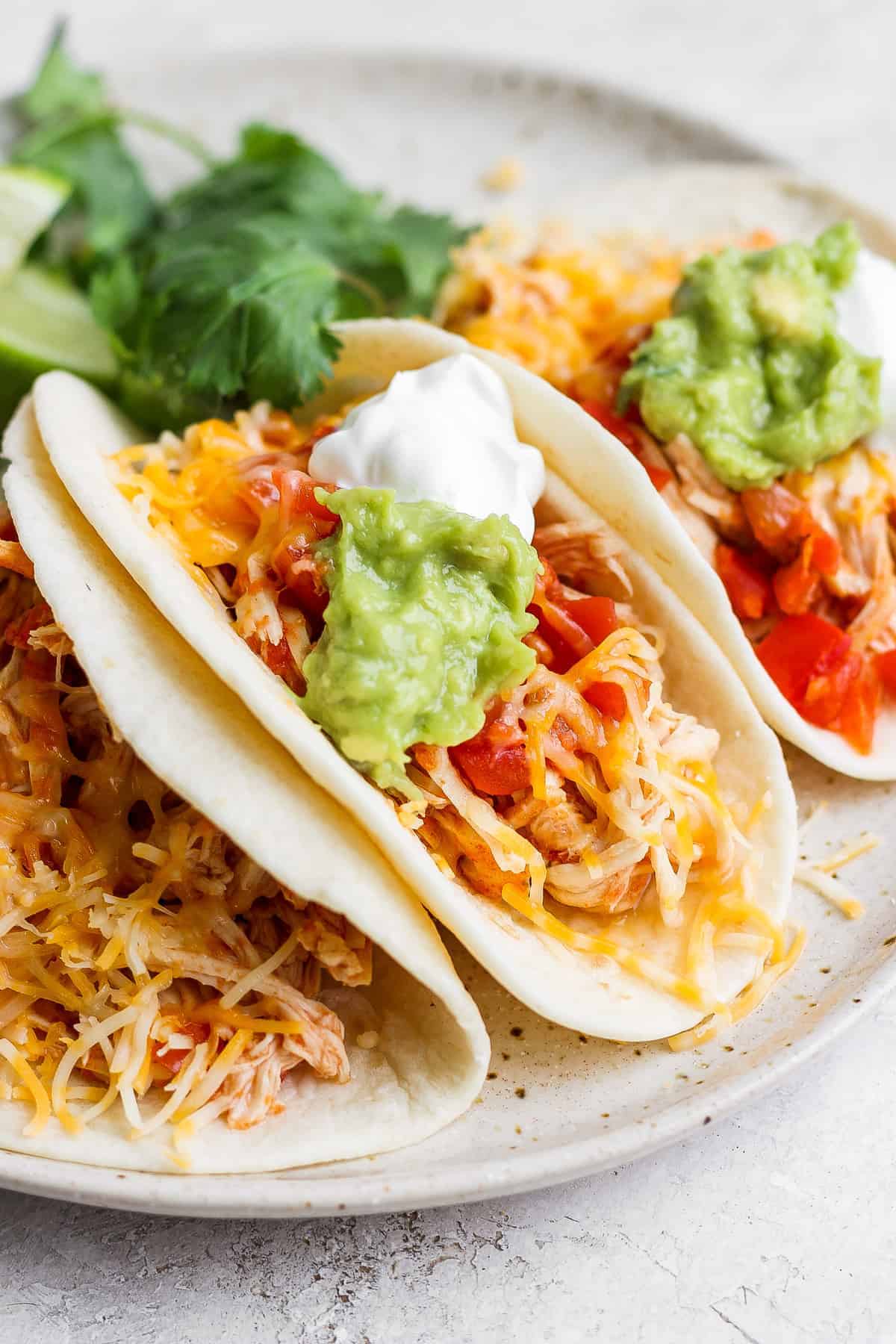 Easy Crockpot Chicken Tacos (4 ingredients!) - Fit Foodie Finds