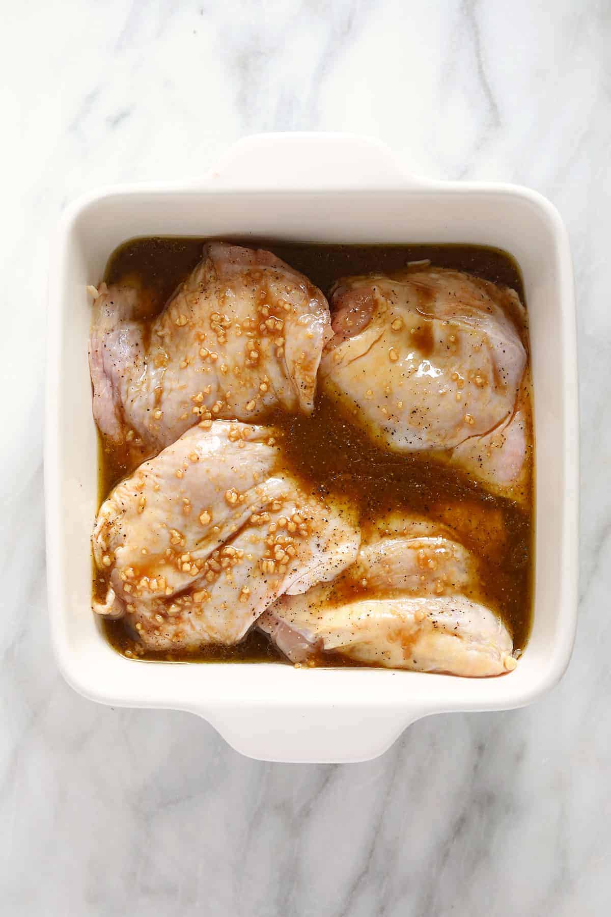 Chicken thighs marinating. 