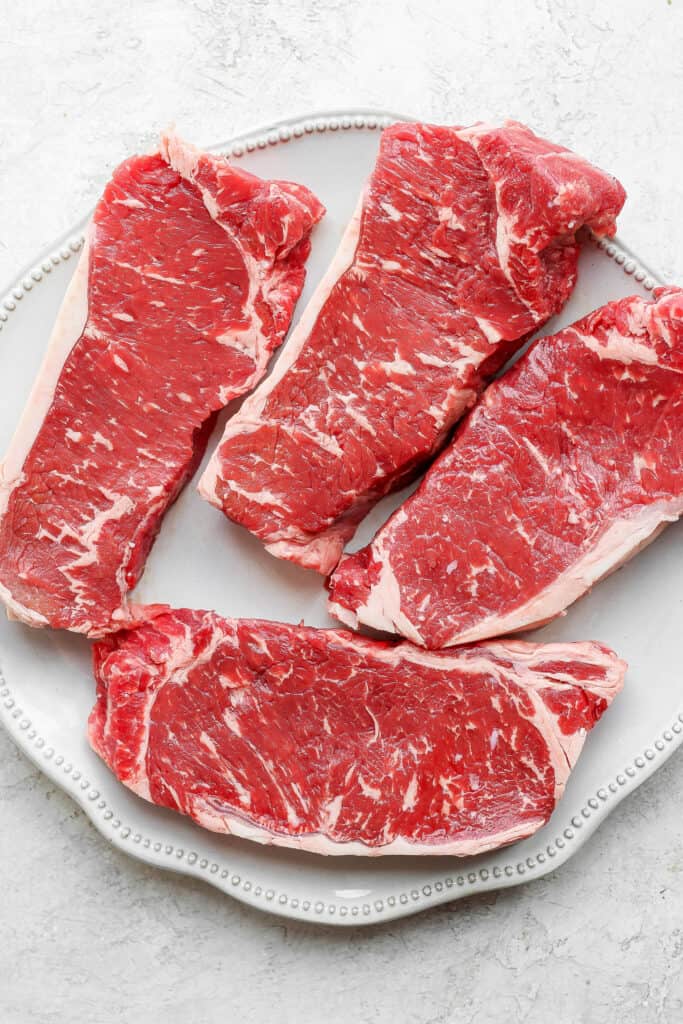 steaks on plate.