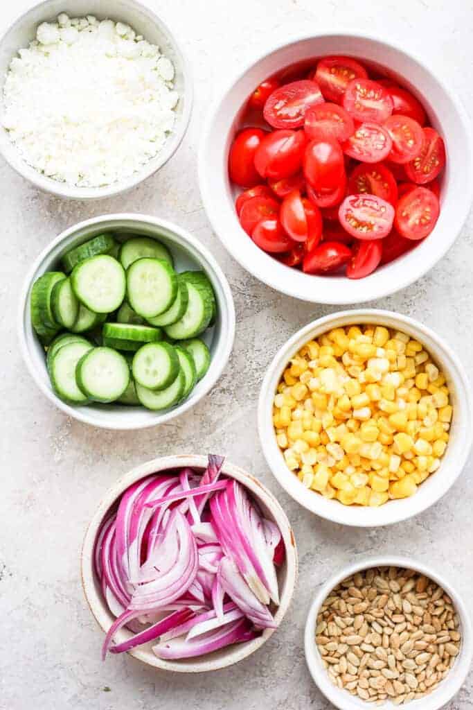 steak salad ingredients in bowls.