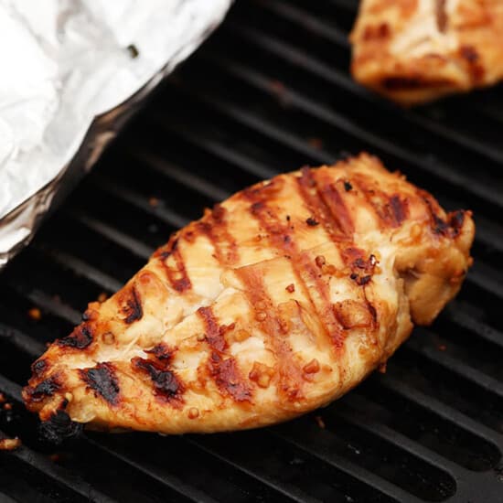 grilling chicken on grill.