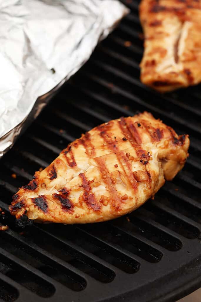 grilling chicken on grill.