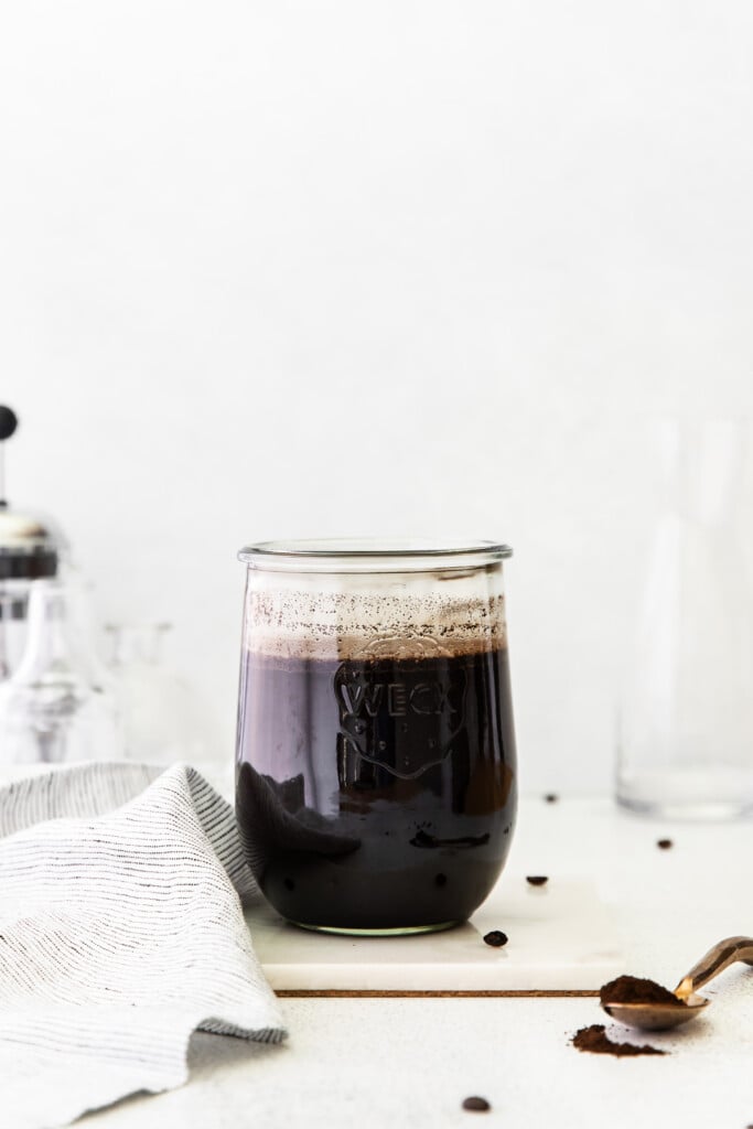 Cold brew coffee sitting in coffee grounds