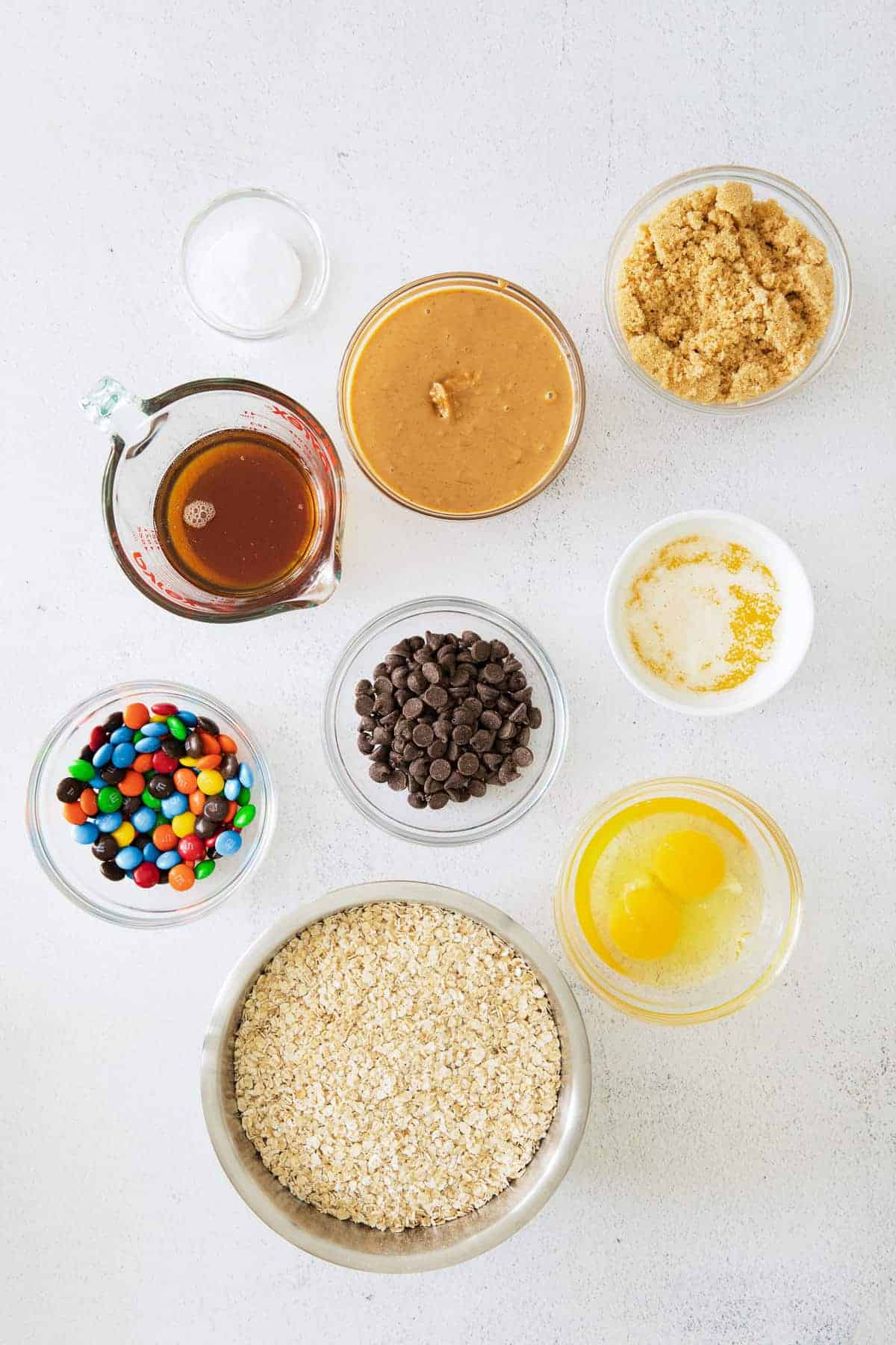 monster cookie bars ingredients on countertop.