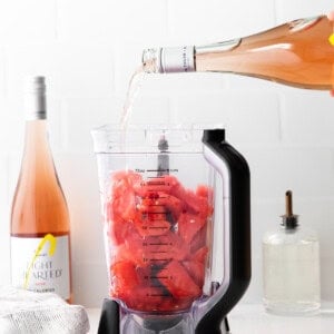 pouring wine into blender.