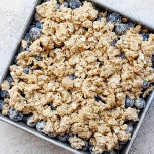 uncooked blueberry crisp in baking dish.
