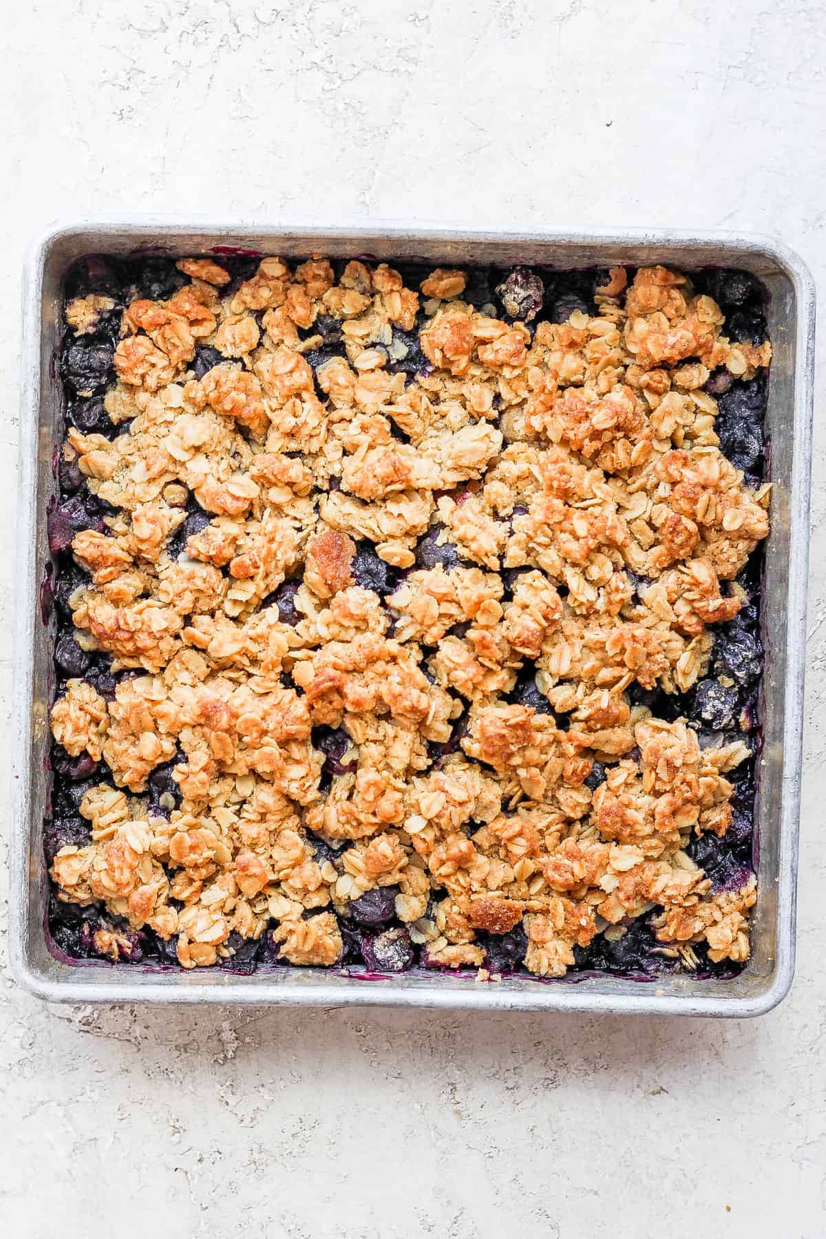 Blueberry crisp with a golden oatmeal topping. 