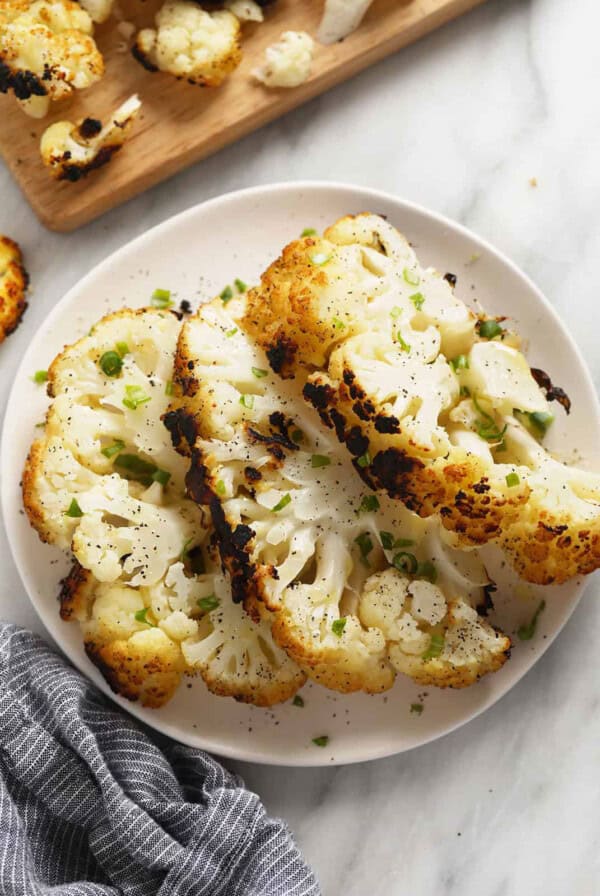 a plate of cauliflower on a table.