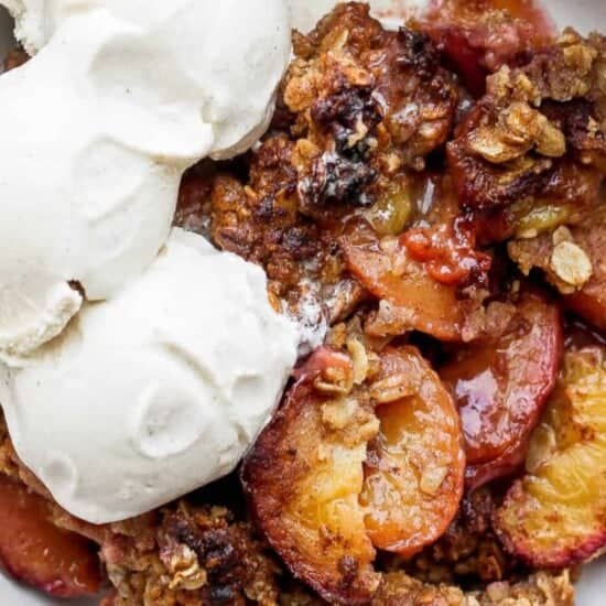 Peach crisp topped with crunchy granola.