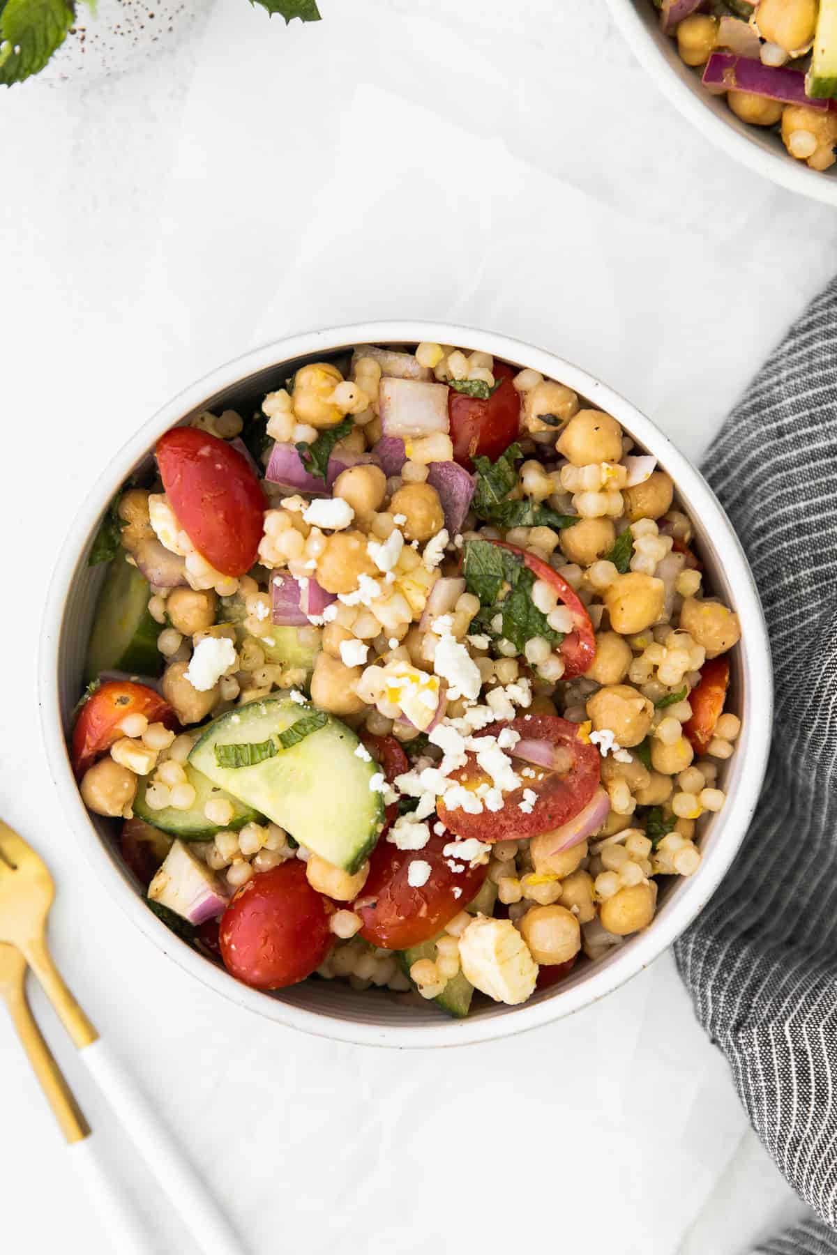 individual serving of mediterranean couscous salad in a bowl