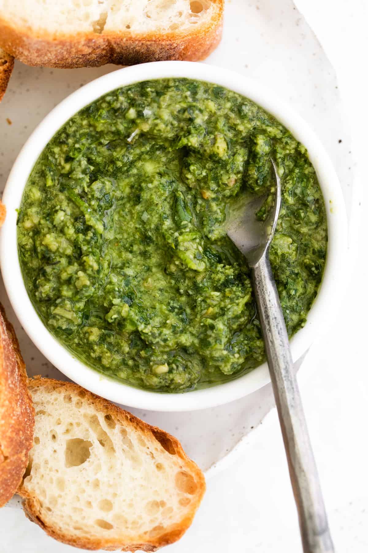 pesto with spoon in bowl