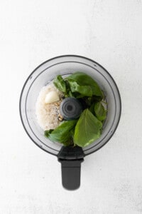 A food processor filled with vegetables and rice.