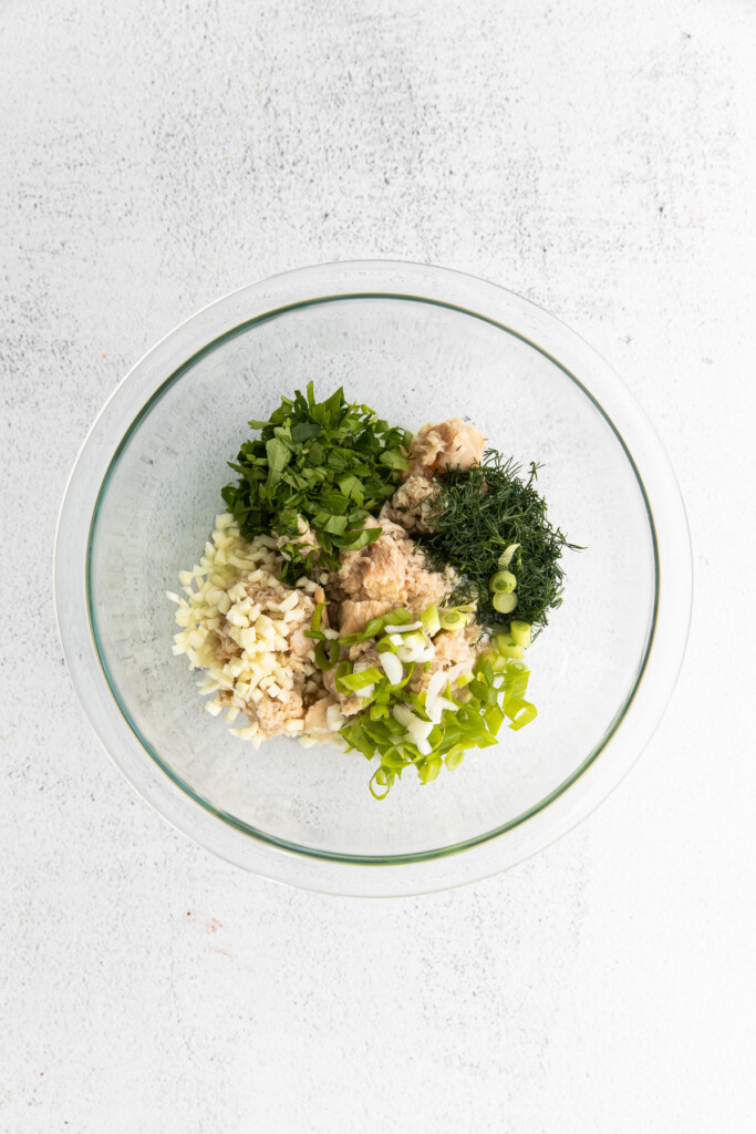 All the ingredients for the salmon salad in a bowl. 