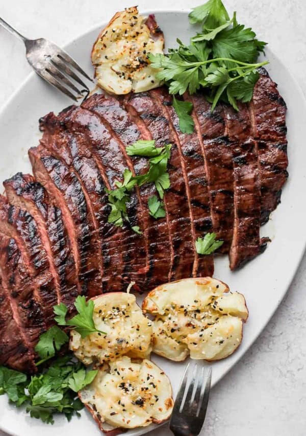 a plate of grilled flank steak