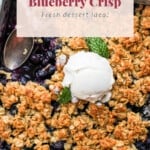 Blueberry crisp with ice cream on top.