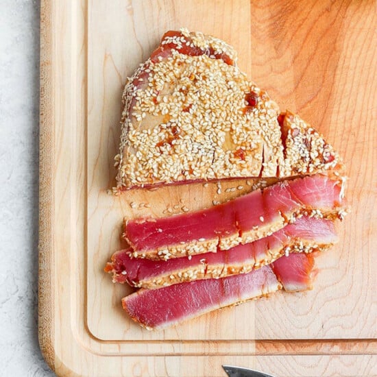 sliced ahi tuna on cutting board