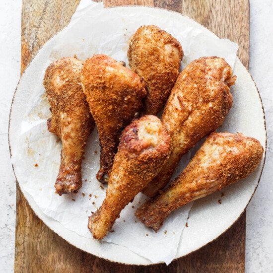 fried chicken legs on a white plate.