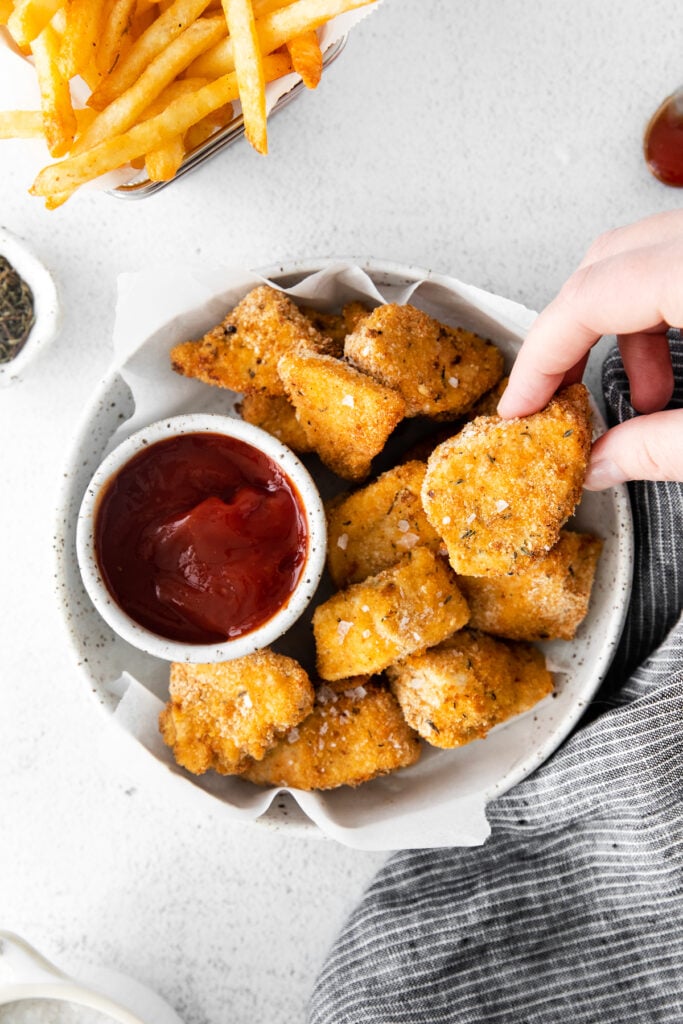 Air fryer chicken nuggets with BBQ sauce. 