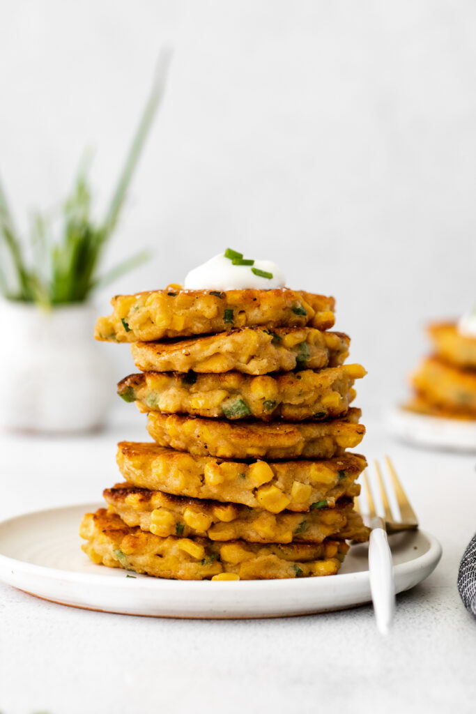 Corn fritters with Greek yogurt on top. 