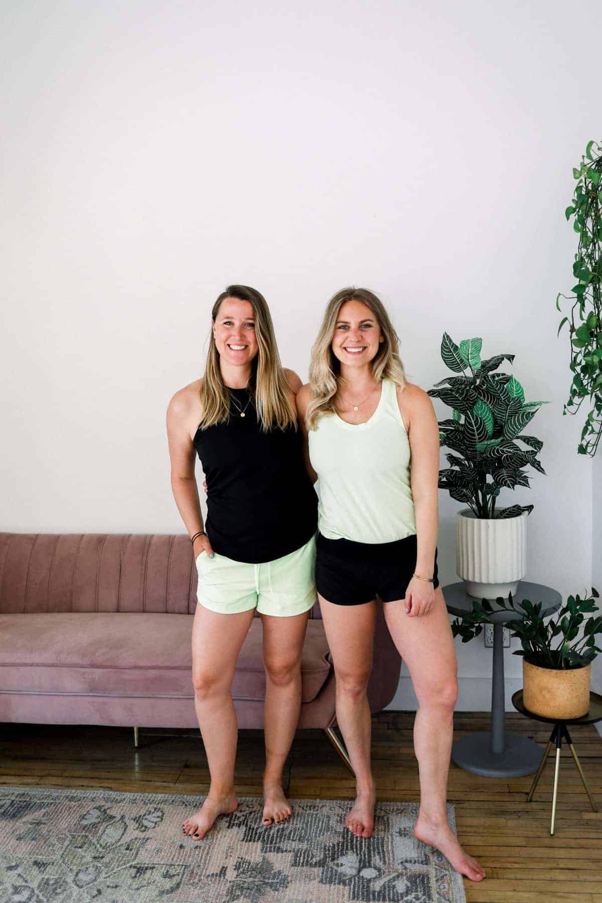 lee and emily wearing lululemon shorts and smiling at the camera