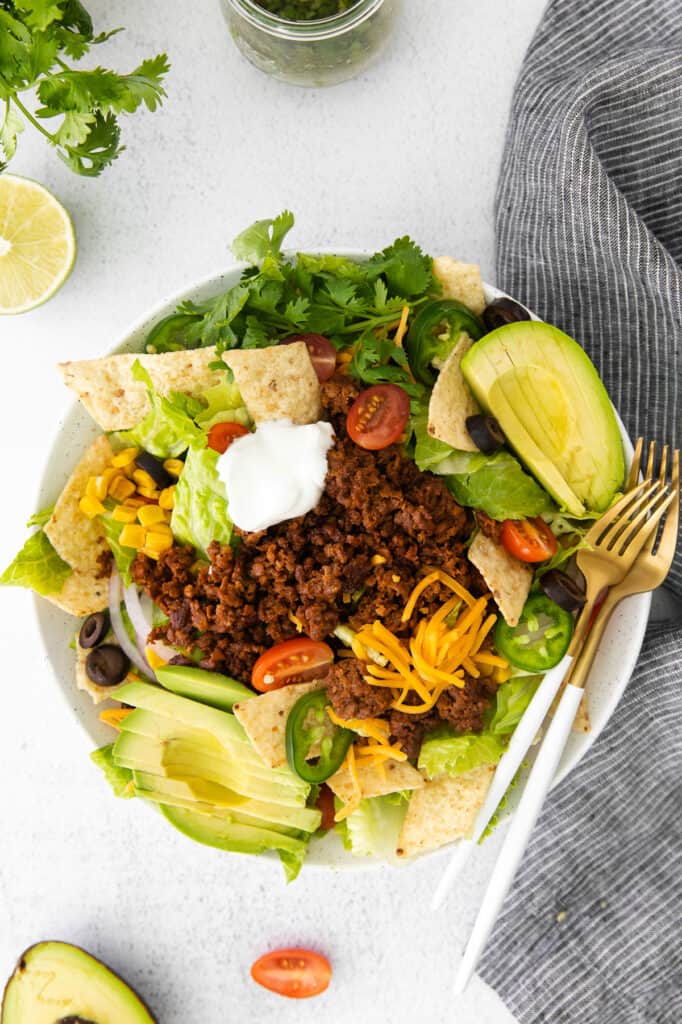 easy taco salad topped with a dollop of greek yogurt