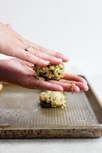 forming cookie dough into cookies.