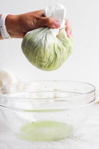 squeezing moisture out of zucchini.