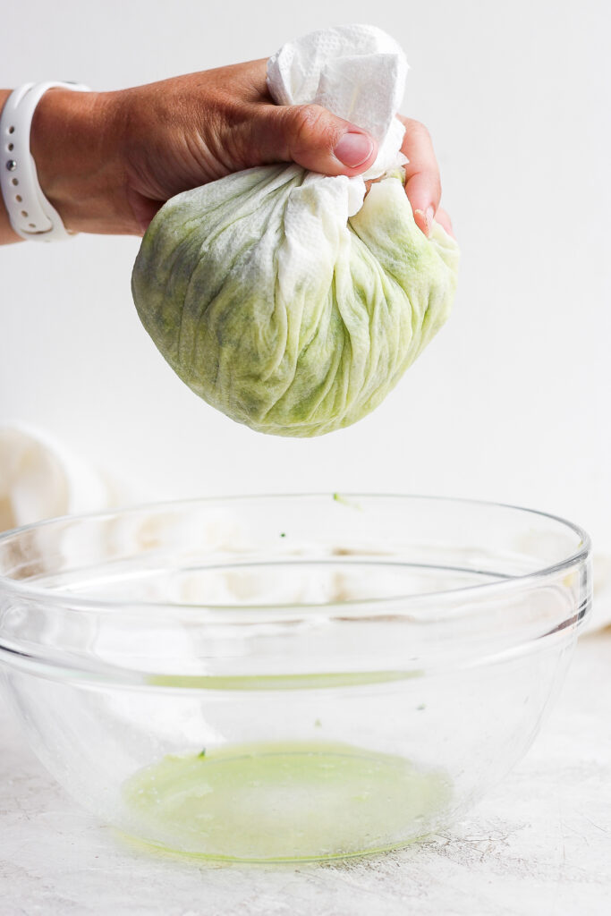 squeezing moisture out of grated zucchini.