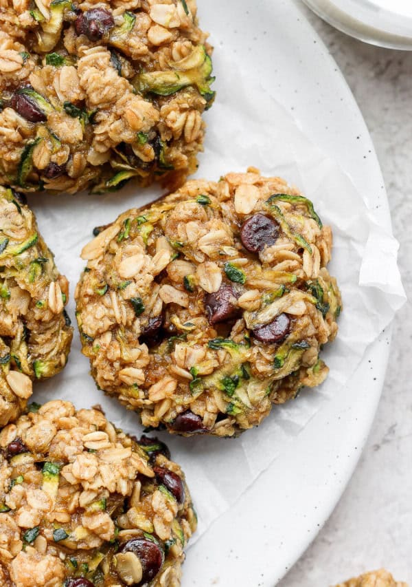 Zucchini oat cookies on a white plate.