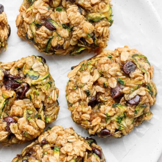 Zucchini oat cookies on a white plate.