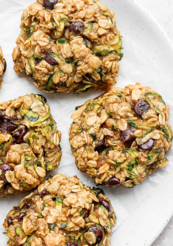 Zucchini oat cookies on a white plate.