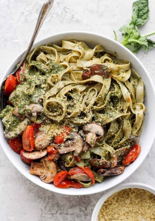 a bowl of vegan pesto pasta