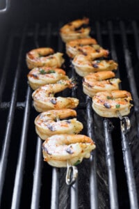 shrimp on skewers on grill.