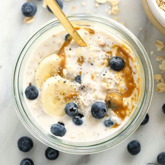 a bowl of oatmeal with blueberries and bananas.