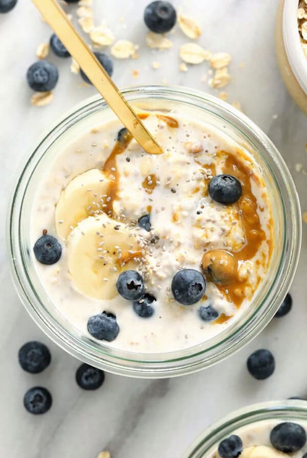 a bowl of oatmeal with blueberries and bananas.