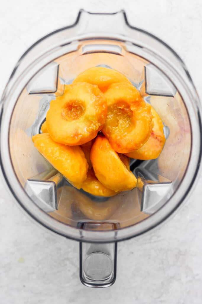 fresh sliced peaches in a blender