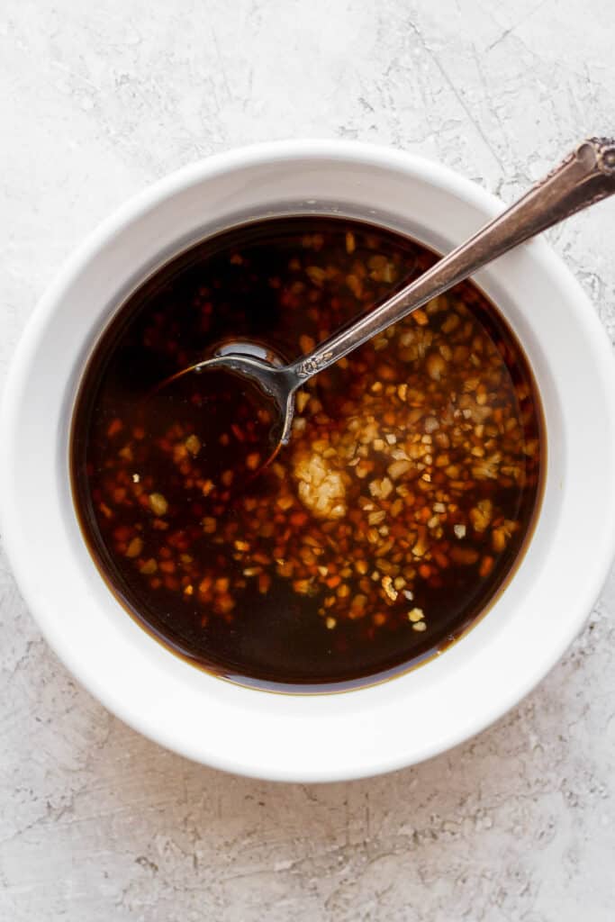 marinade in bowl with spoon.
