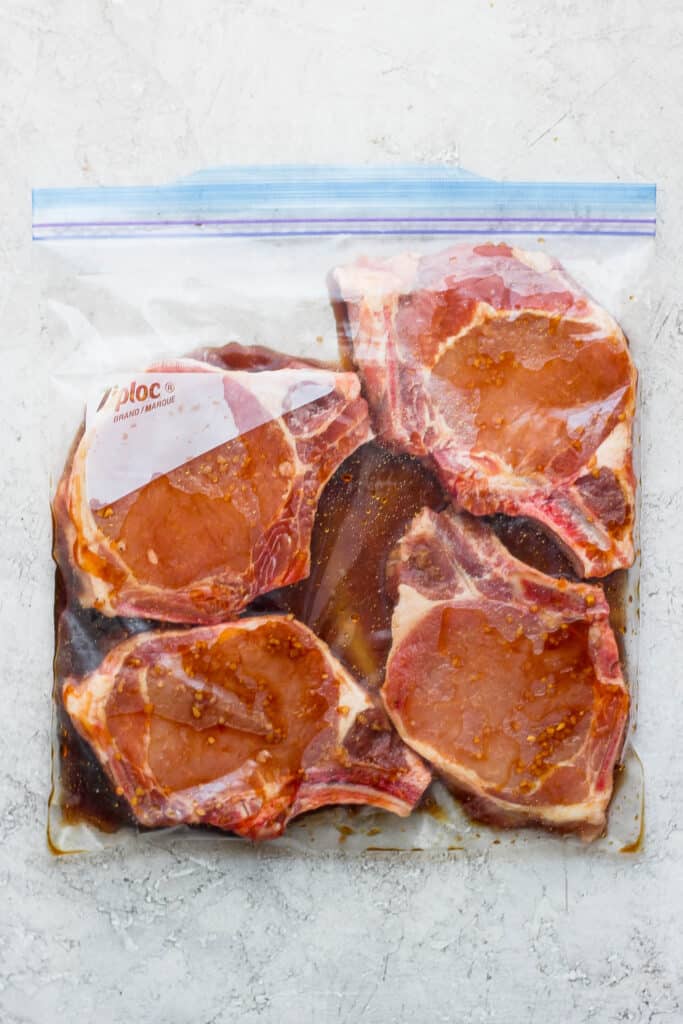 pork chops marinating in bag.