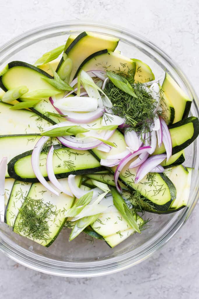 zucchini salad ingredients ready to be tossed together with a dressing