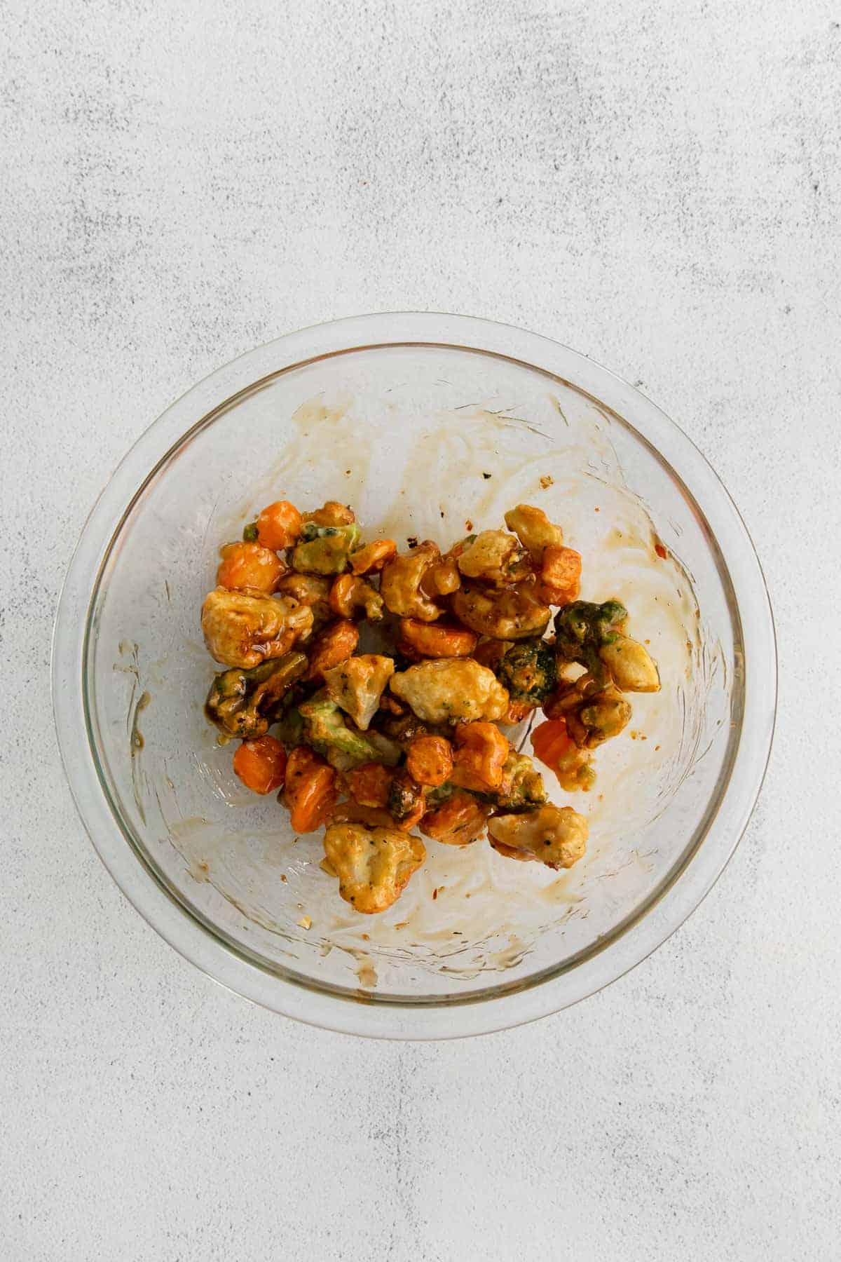 tossing veggies in sweet and sour sauce