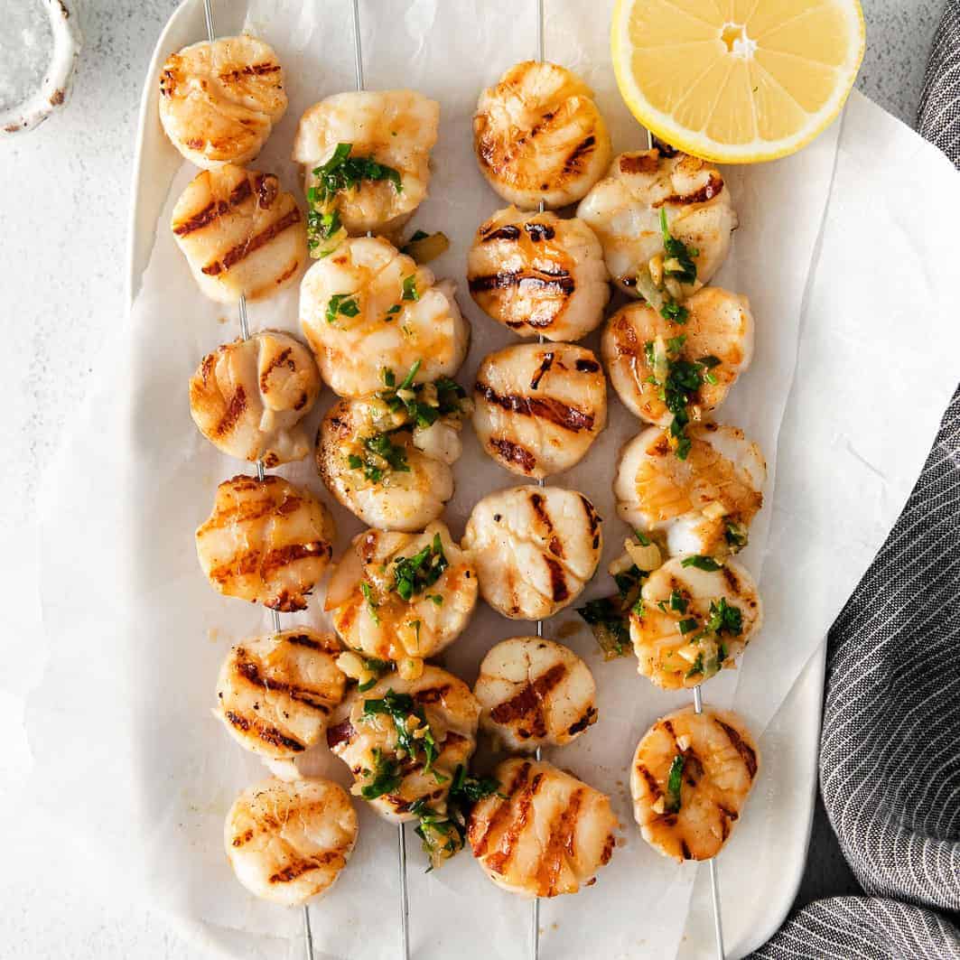 Perfect Grilled Scallops (w/ herby white wine sauce) - Fit Foodie Finds