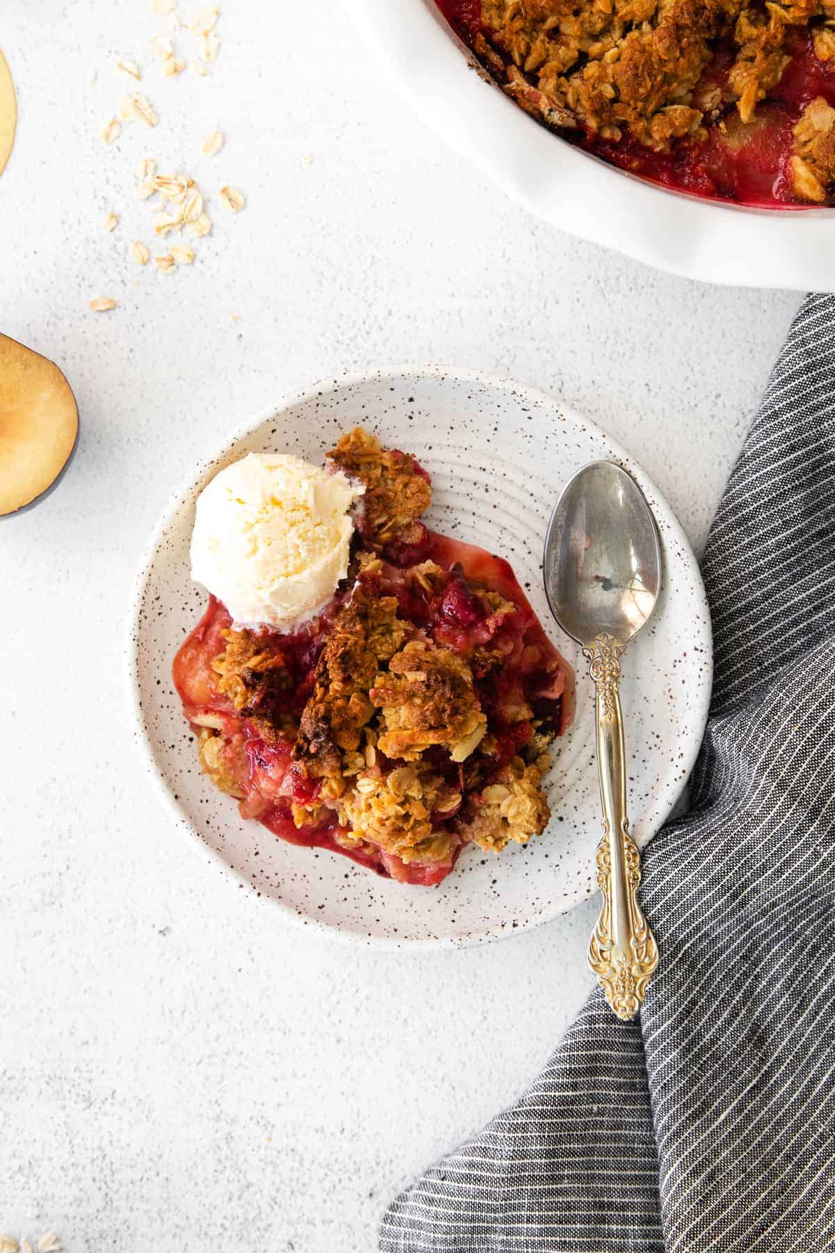 serving of crisp on plate with spoon