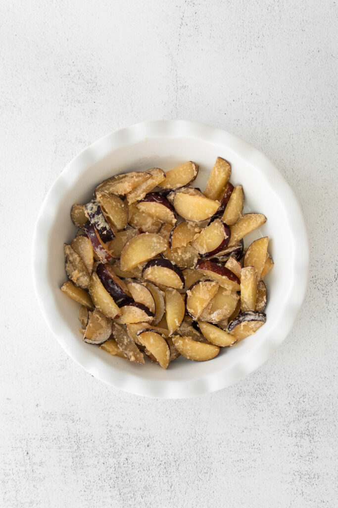 fresh plums inside baking dish