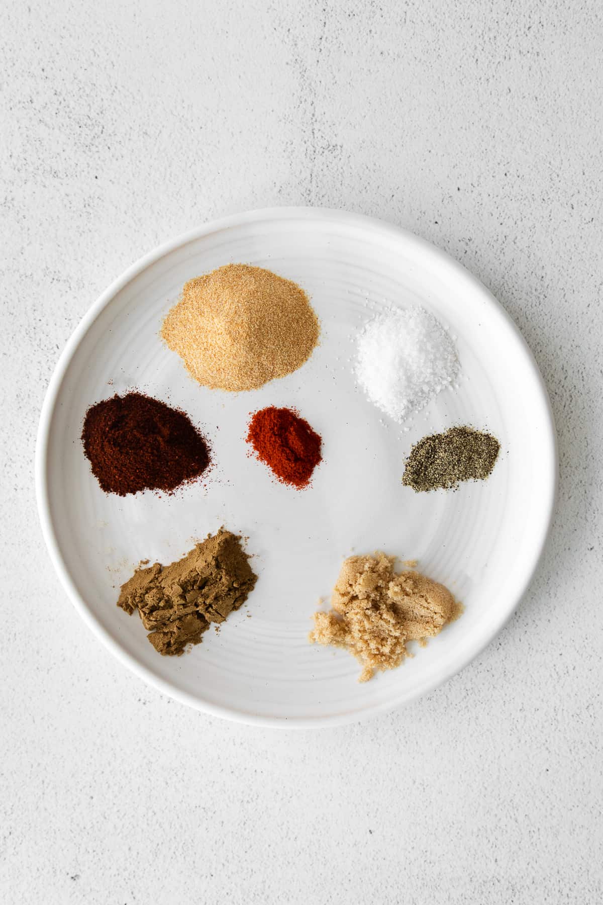 ingredients for steak taco seasoning on a plate