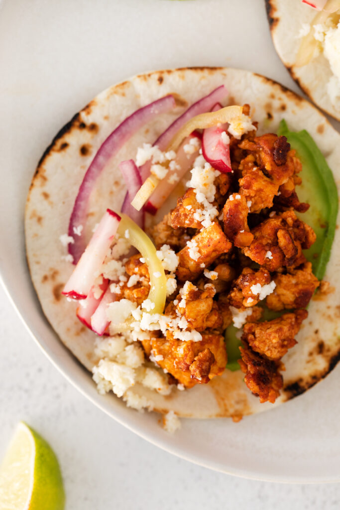 Tofu tacos in a flour tortilla. 