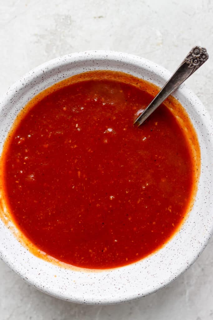 homemade BBQ sauce in a bowl with a spoon