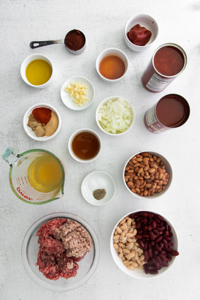 instant pot chili ingredients in bowls ready to be mixed together.